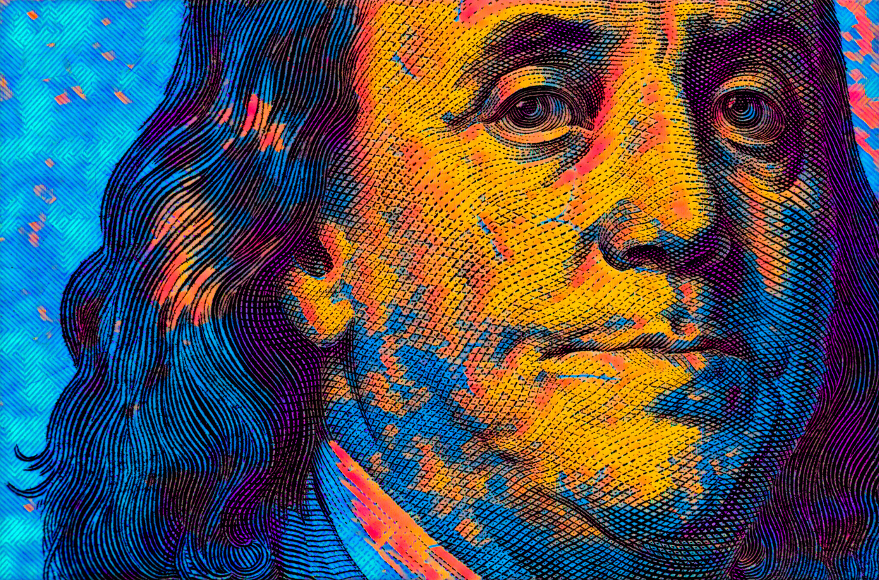 colored 100 dollar banknote fragment for design purpose Benjamin Franklin closeup